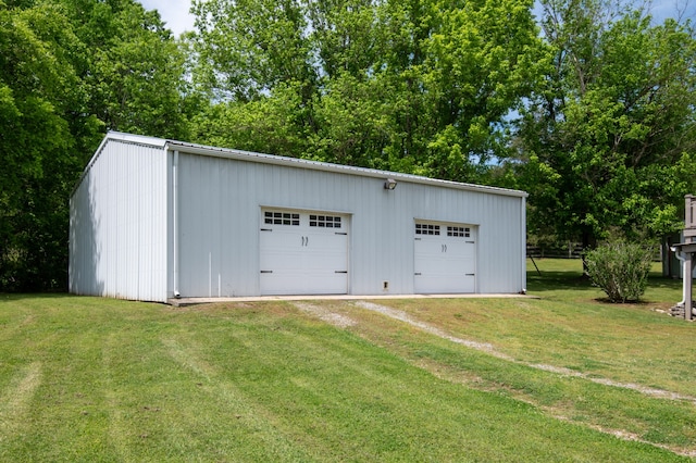 garage featuring a yard