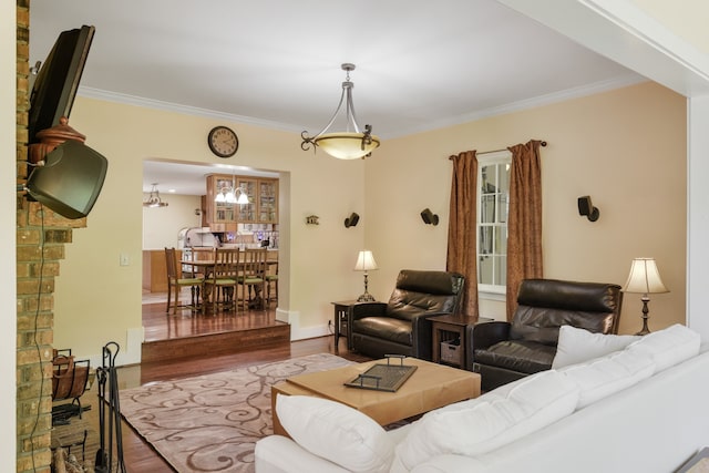 living room featuring crown molding and wood-type flooring