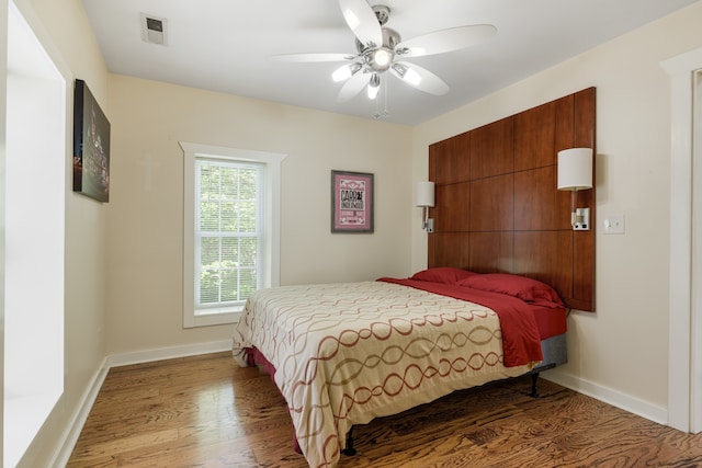 bedroom featuring wood-type flooring and ceiling fan