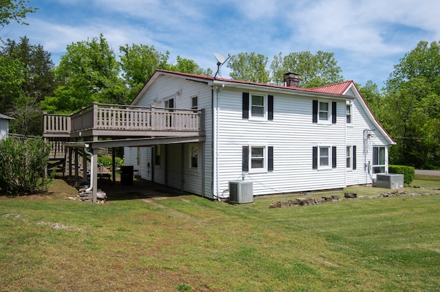 back of property featuring a yard, a deck, and central AC unit