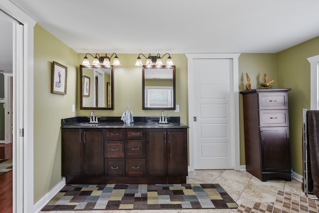 bathroom with vanity and tile patterned flooring