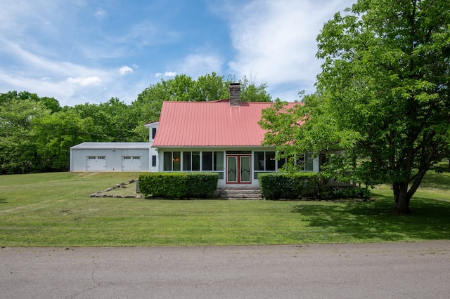 view of front of home featuring a garage and a front lawn