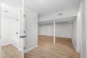 basement featuring light wood-type flooring