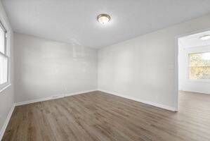 spare room featuring dark wood-type flooring