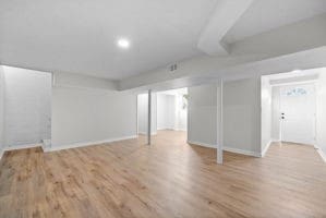 basement featuring light wood-type flooring