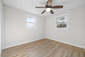 unfurnished room featuring light hardwood / wood-style flooring and ceiling fan