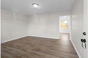 unfurnished room featuring dark hardwood / wood-style flooring