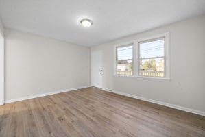 empty room featuring hardwood / wood-style floors