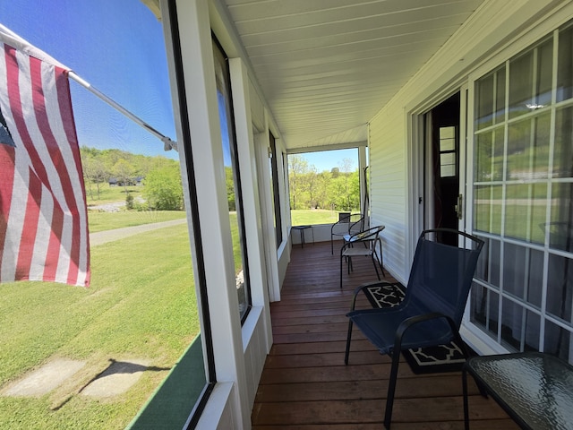 sunroom / solarium with vaulted ceiling