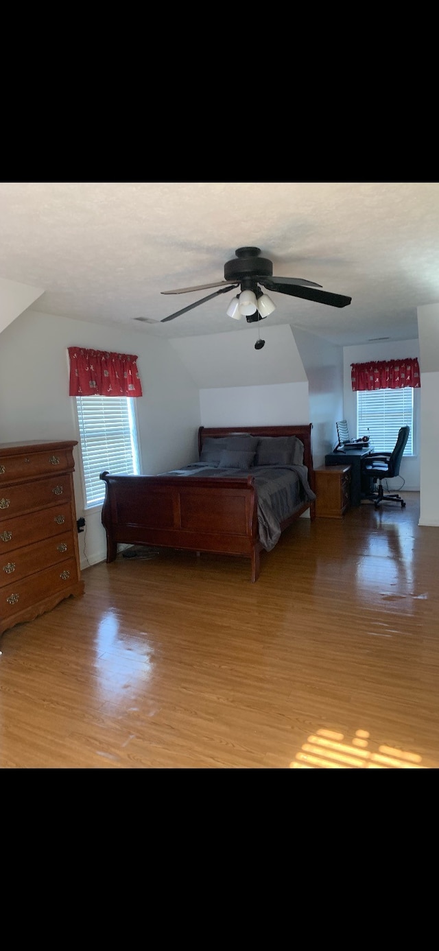 unfurnished bedroom featuring wood-type flooring and ceiling fan