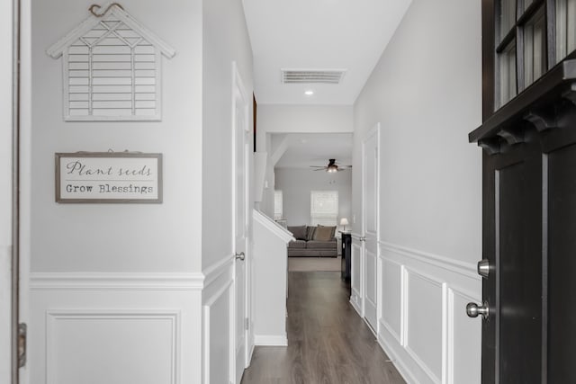 hall with dark hardwood / wood-style flooring