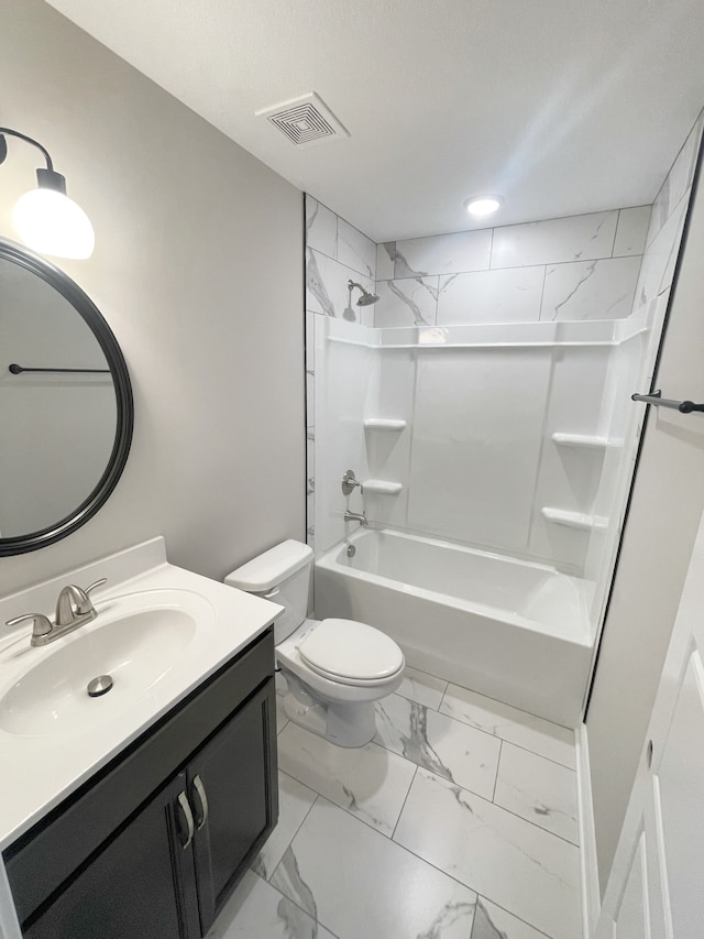 full bathroom featuring toilet, tiled shower / bath, and vanity