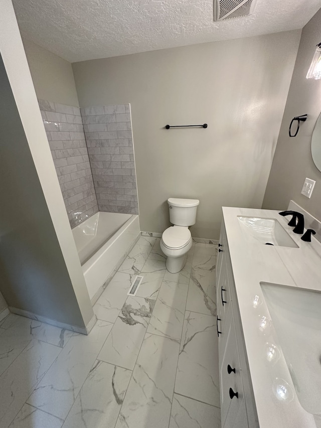 full bathroom featuring vanity, toilet, shower / bath combination, and a textured ceiling