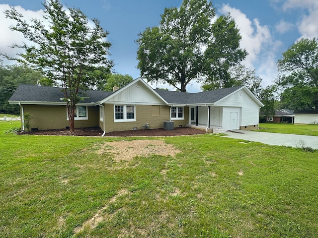 view of front of house with a front lawn and central AC unit