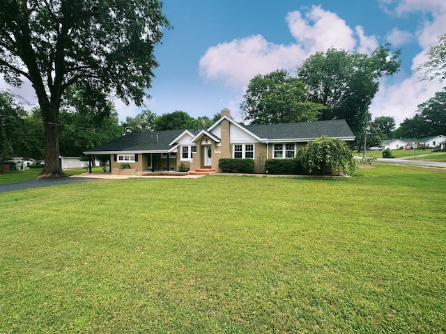 ranch-style house with a front yard