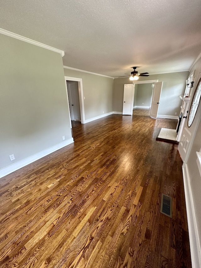 unfurnished living room with wood-type flooring, a textured ceiling, ceiling fan, and crown molding