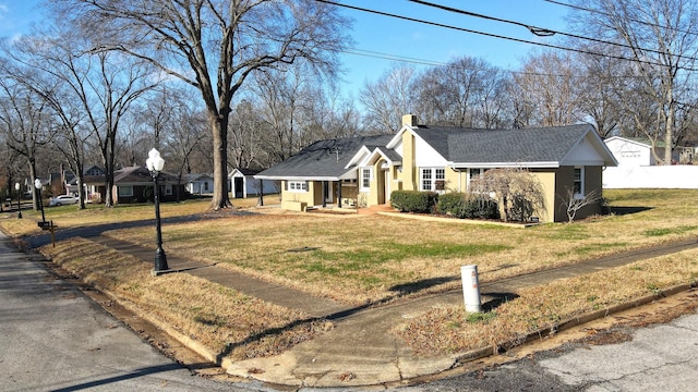 view of front of property with a front lawn