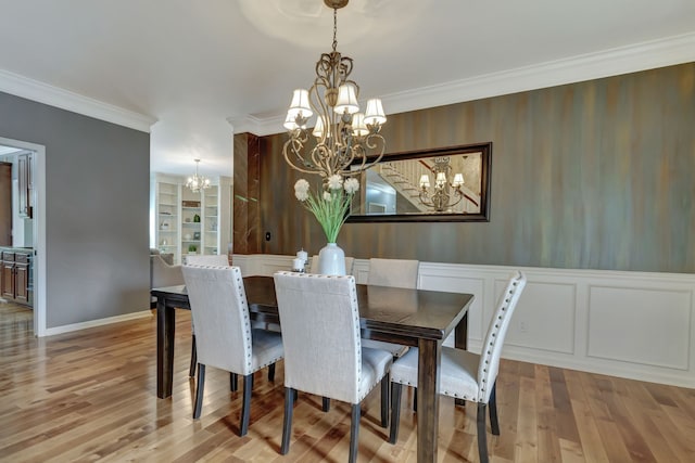 dining area featuring ornamental molding, light wood-type flooring, and built in shelves