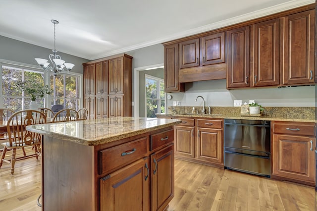 kitchen with a notable chandelier, dishwasher, hanging light fixtures, and light hardwood / wood-style floors