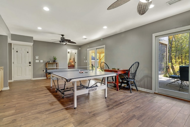 playroom with wood-type flooring and ceiling fan