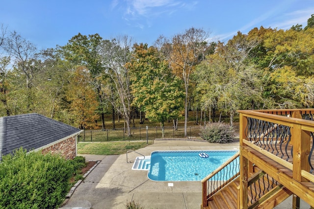 view of swimming pool featuring a patio area