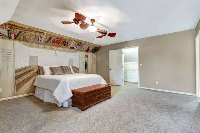 bedroom with a closet, a spacious closet, carpet, and ceiling fan