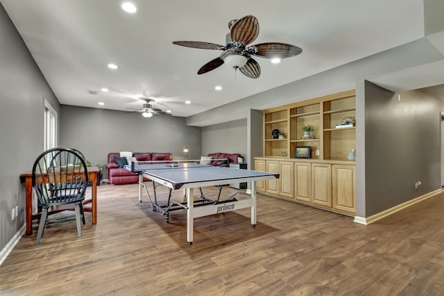 rec room with ceiling fan and hardwood / wood-style flooring