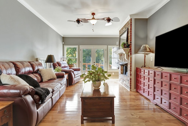 living room with crown molding, light hardwood / wood-style floors, and ceiling fan