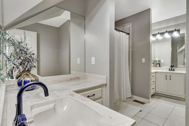 bathroom with vanity and tile patterned floors