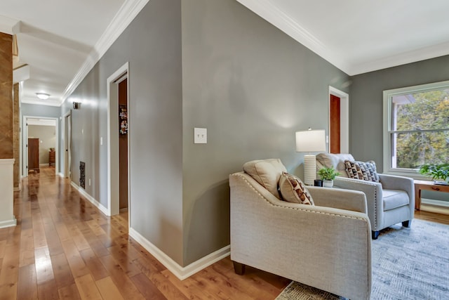 interior space with ornamental molding and light wood-type flooring