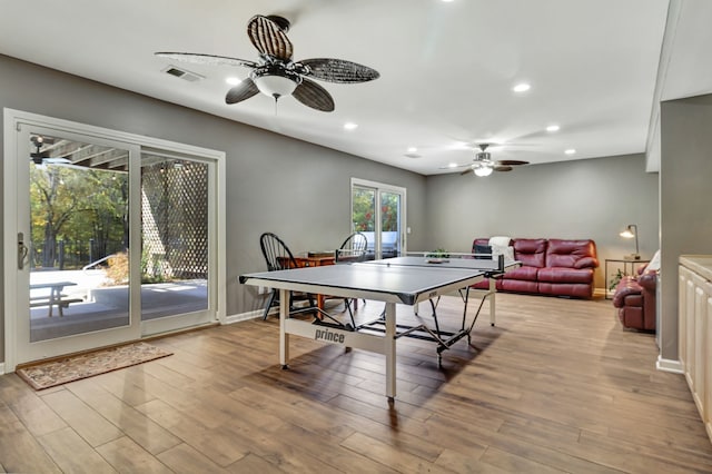 playroom with ceiling fan and light wood-type flooring