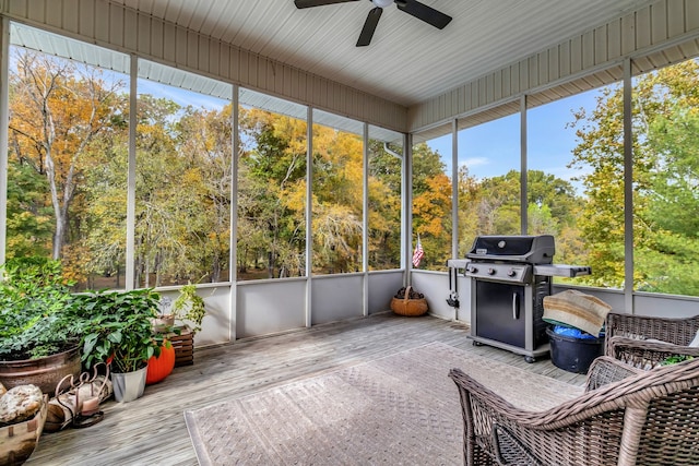 sunroom / solarium featuring ceiling fan