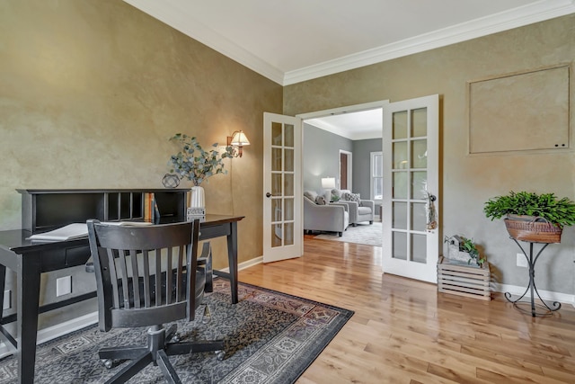 home office featuring french doors, ornamental molding, and hardwood / wood-style flooring