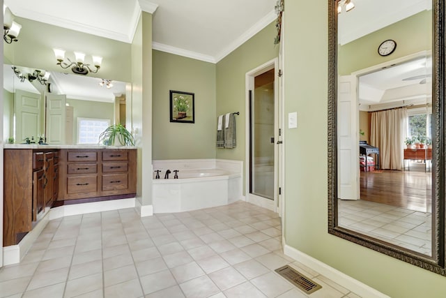 bathroom with vanity, crown molding, a healthy amount of sunlight, and plus walk in shower