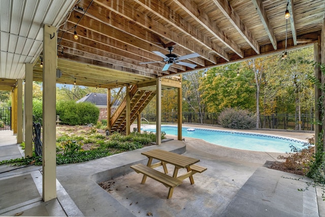 view of swimming pool with a patio area and ceiling fan