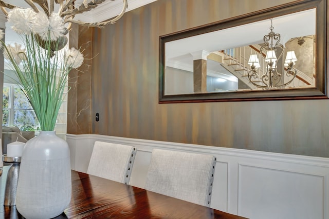 dining room with a notable chandelier and wood-type flooring