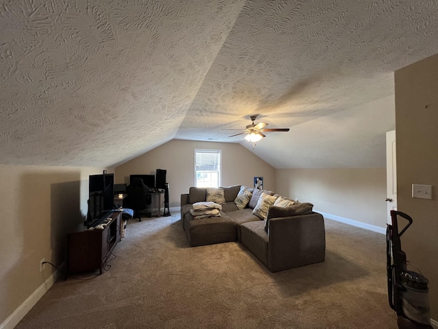 living room with vaulted ceiling, a textured ceiling, ceiling fan, and carpet