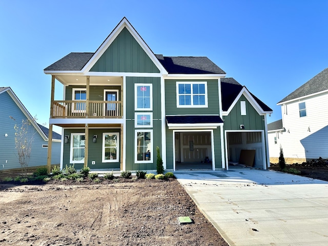 view of front of home featuring a garage and a balcony