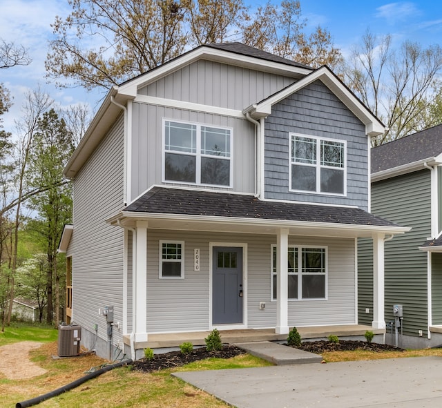 view of front of property with central air condition unit and a porch