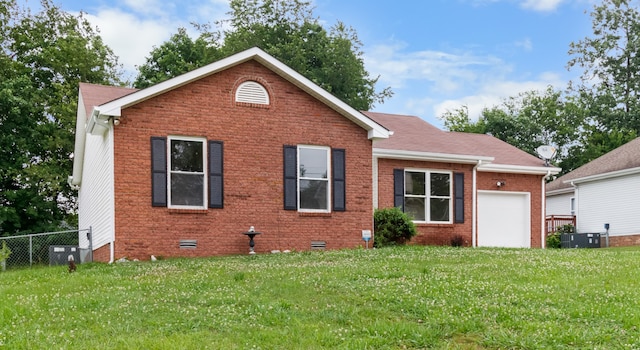 view of front of home featuring central AC, a front lawn, and a garage