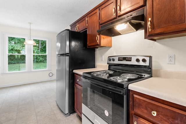 kitchen featuring appliances with stainless steel finishes and pendant lighting