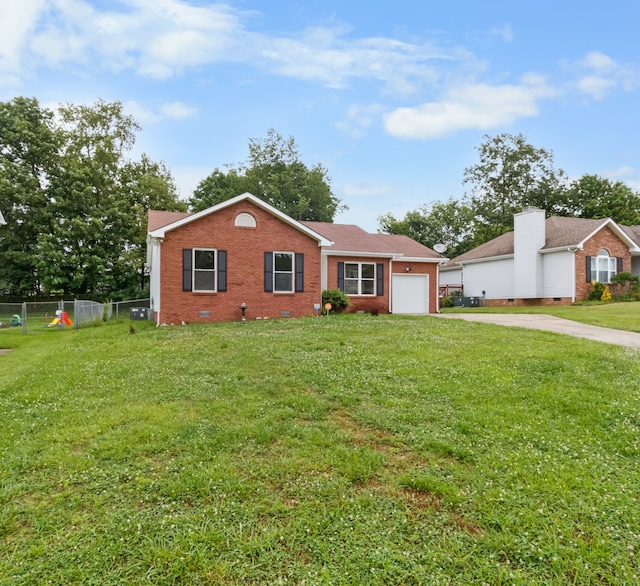 ranch-style home with a front lawn and a garage