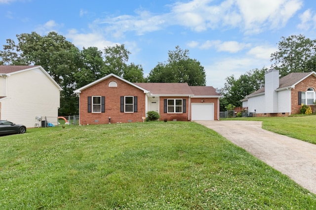 ranch-style home with a front yard and a garage