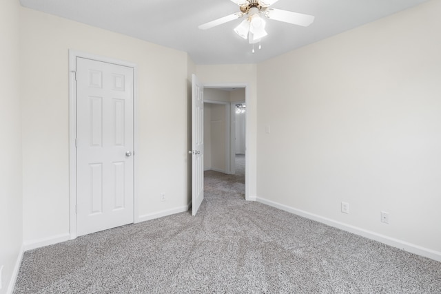 unfurnished bedroom with ceiling fan and carpet flooring