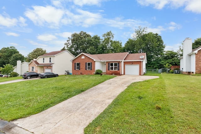 view of front of home featuring a garage and a front lawn