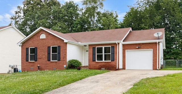 ranch-style house featuring a garage and a front lawn