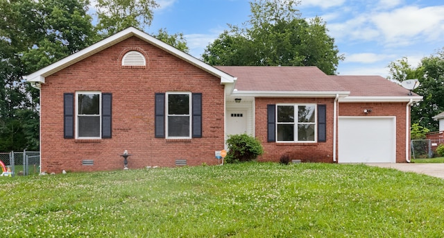 view of front of house featuring a front lawn and a garage