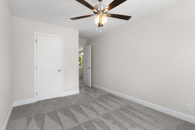 unfurnished bedroom with light carpet and ceiling fan