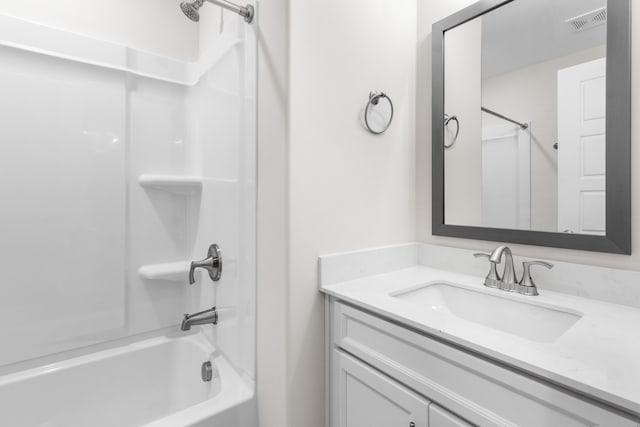 bathroom featuring vanity and shower / washtub combination