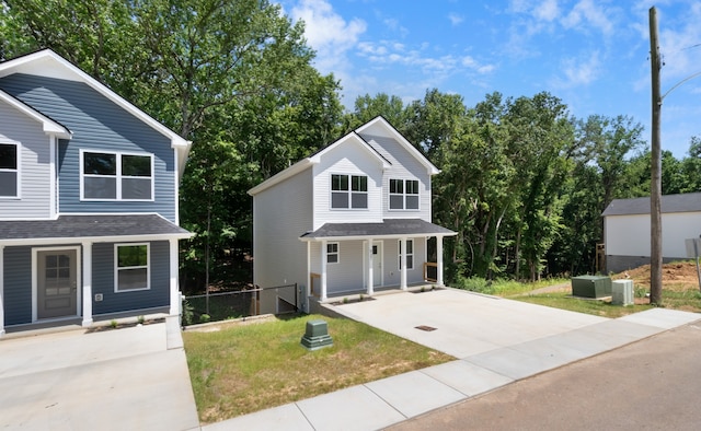 view of property with a front lawn and a porch